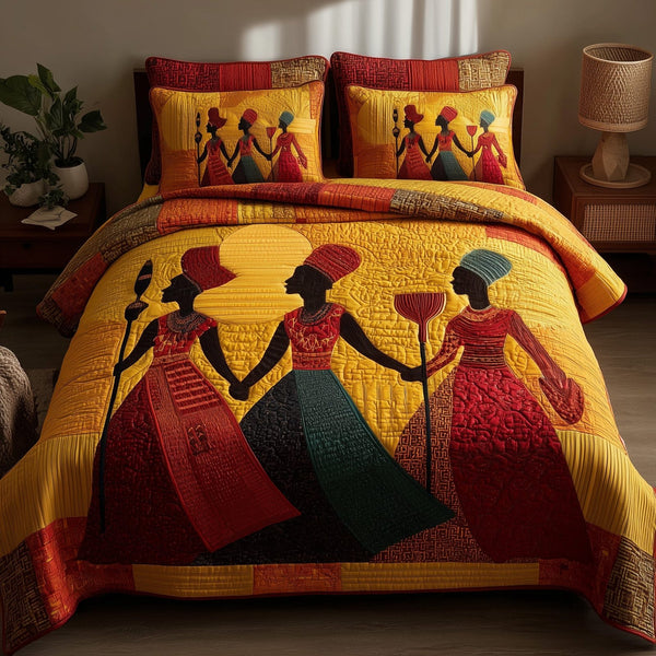 Proud To Rise quilted 3-piece bedding set on a made bed with two matching pillow shams