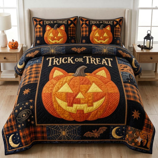 Pumpkin Night quilted 3-piece bedding set on a made bed against a dark styled interior
