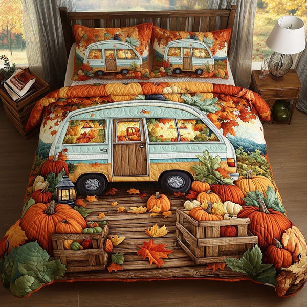 Pumpkin Patch Camper quilted 3-piece bedding set on a made bed against a dark styled interior