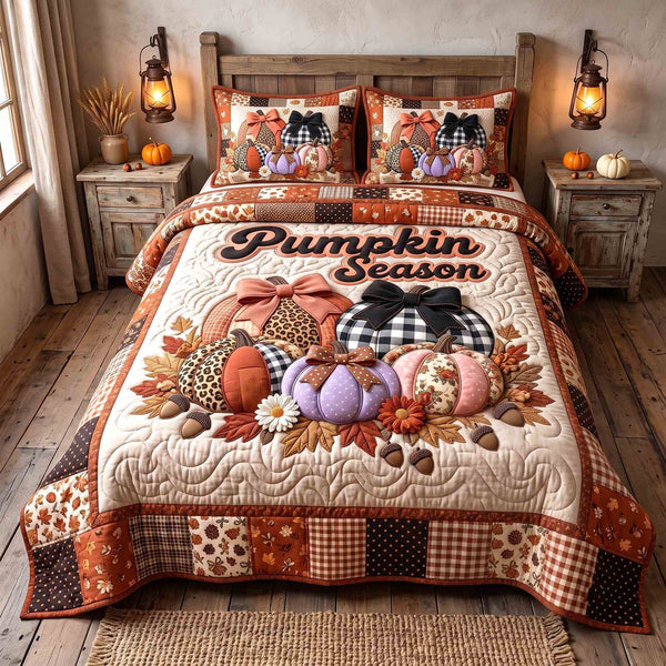 Pumpkin Season quilted 3-piece bedding set on a made bed against a dark styled interior