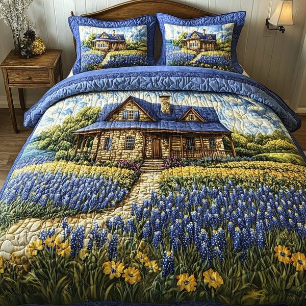 Pure Bluebonnet quilted 3-piece bedding set on a made bed with two matching pillow shams