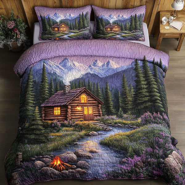 Purple Cabin Meadow quilted 3-piece bedding set on a made bed with two matching pillow shams