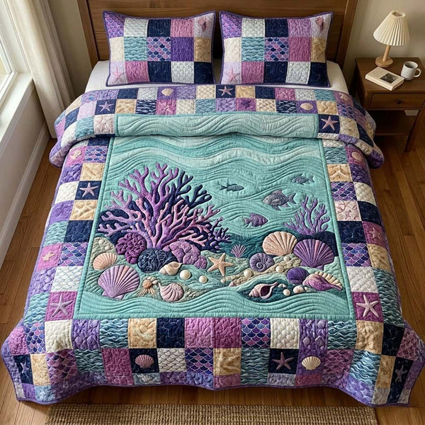 Purple Coral quilted 3-piece bedding set on a made bed in a light coastal bedroom