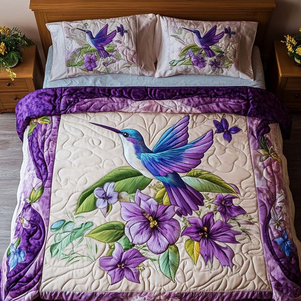 Purple Dreams quilted 3-piece bedding set on a made bed with two matching pillow shams