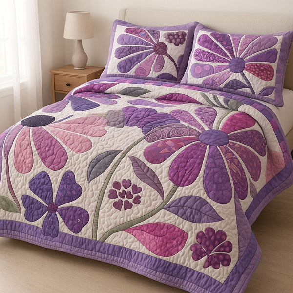 Purple Garden quilted 3-piece bedding set on a made bed with two matching pillow shams