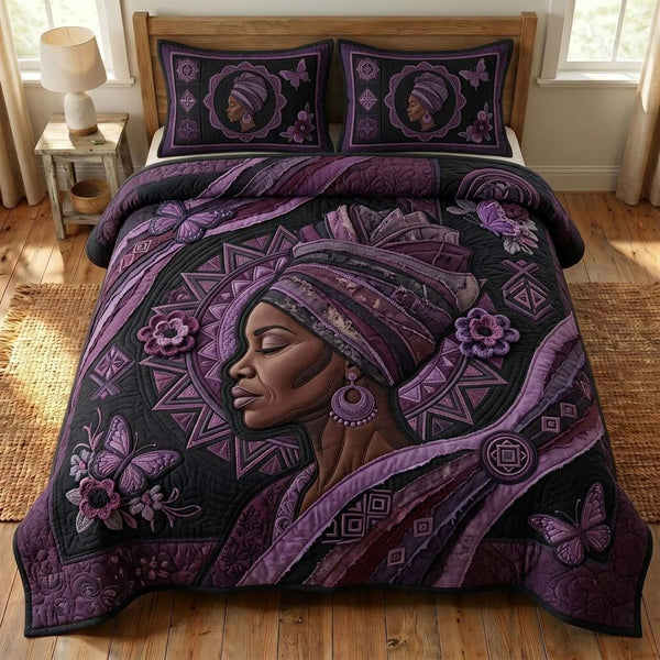 Purple Grace quilted 3-piece bedding set on a made bed with two matching pillow shams