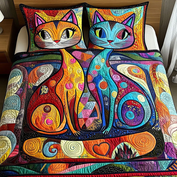 Purrfect Pair quilted 3-piece bedding set on a made bed with two matching pillow shams