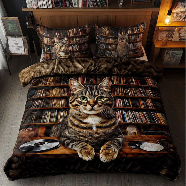 Purring Pages quilted 3-piece bedding set on a made bed with two matching pillow shams