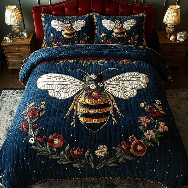 Queen Bee Charm quilted 3-piece bedding set on a made bed with two matching pillow shams