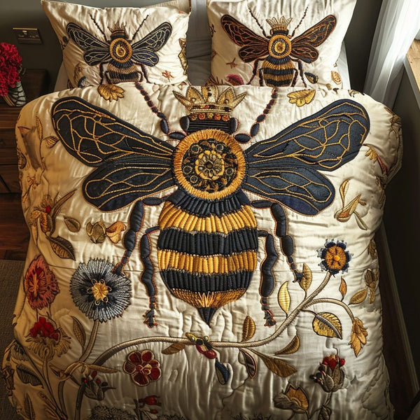 Queen Bee quilted 3-piece bedding set on a made bed with two matching pillow shams