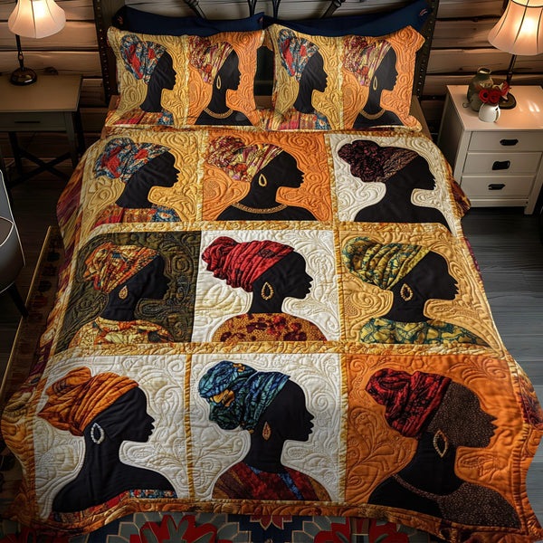 Queen Essence quilted 3-piece bedding set on a made bed with two matching pillow shams