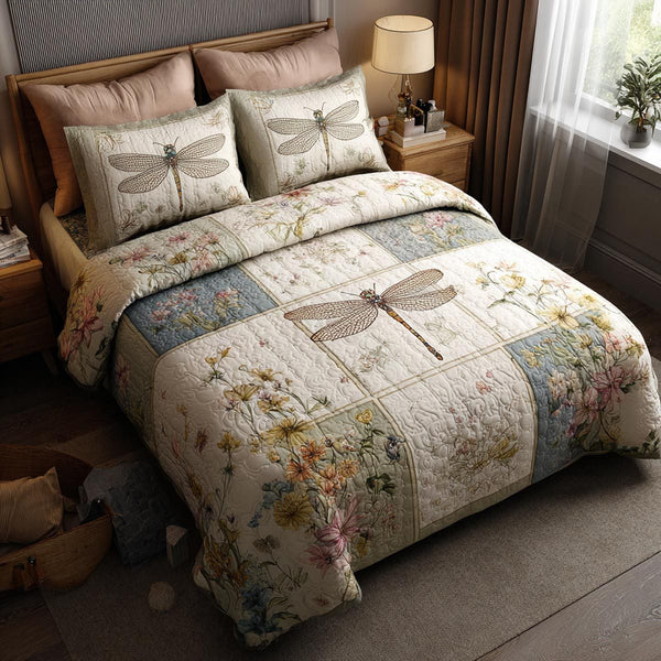 Quiet Dragonfly quilted 3-piece bedding set on a made bed with two matching pillow shams