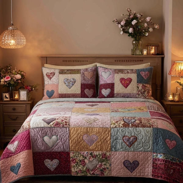 Quiet Love quilted 3-piece bedding set on a made bed with two matching pillow shams