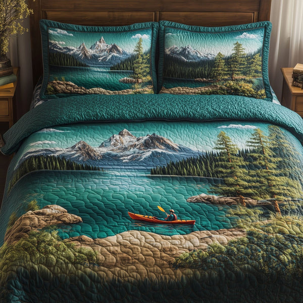Quiet Quest quilted 3-piece bedding set on a made bed with two matching pillow shams