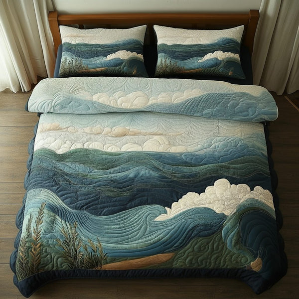 Quiet Tides quilted 3-piece bedding set on a made bed with two matching pillow shams