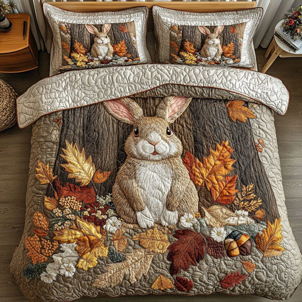 Rabbit in the Fall Woods quilted 3-piece bedding set on a made bed with two matching pillow shams