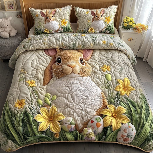 Rabbit Retreat quilted 3-piece bedding set on a made bed with two matching pillow shams