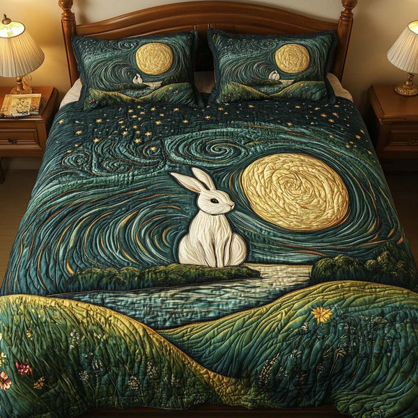 Rabbit Serenity quilted 3-piece bedding set on a made bed with two matching pillow shams