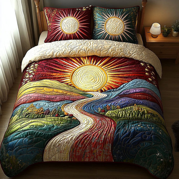 Radiant Bliss quilted 3-piece bedding set on a made bed with two matching pillow shams