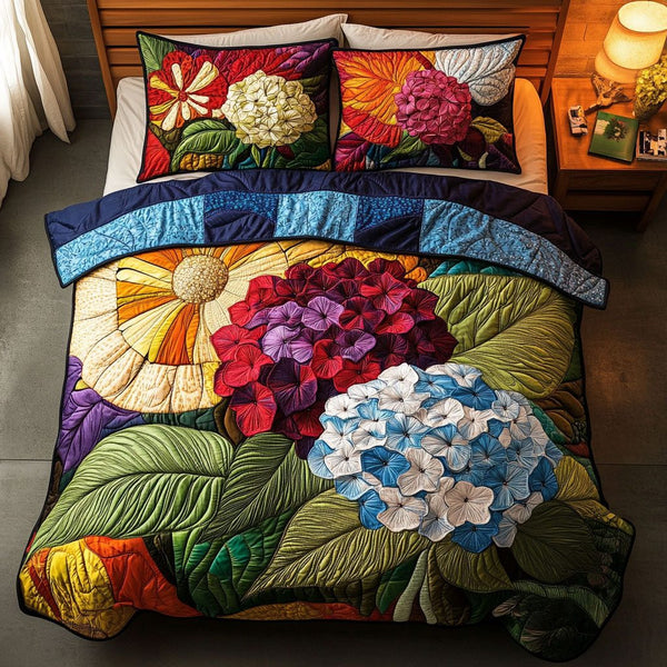 Radiant Blooms quilted 3-piece bedding set on a made bed with two matching pillow shams