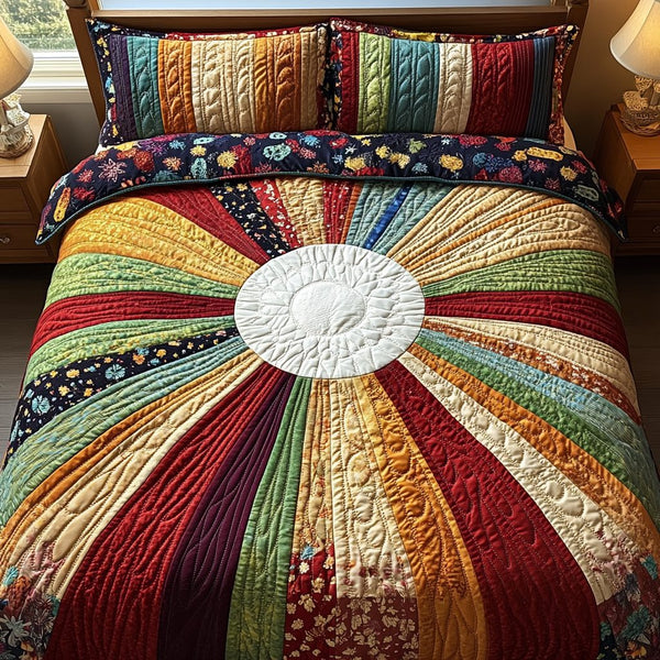 Radiant Dawn quilted 3-piece bedding set on a made bed with two matching pillow shams