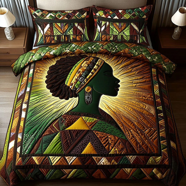 Radiant Essence quilted 3-piece bedding set on a made bed with two matching pillow shams