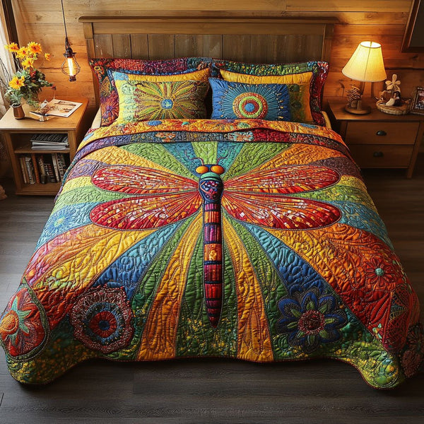 Radiant Flight Ensemble quilted 3-piece bedding set on a made bed with two matching pillow shams