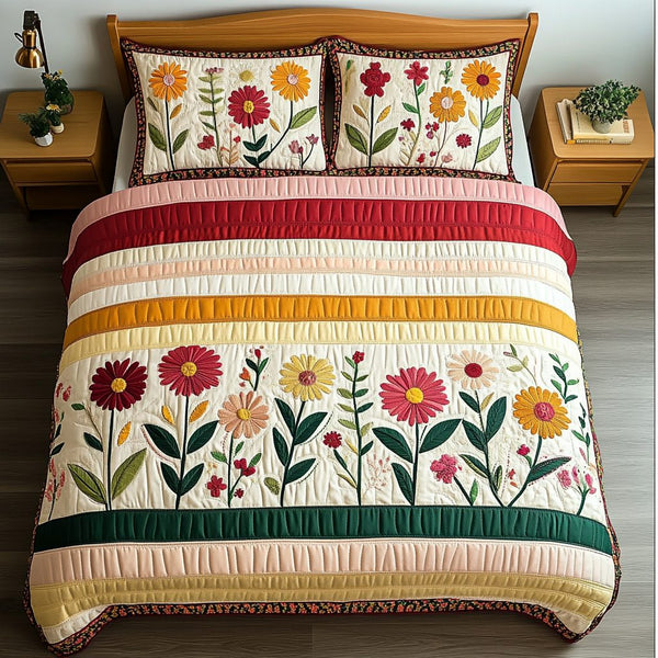 Radiant Petals quilted 3-piece bedding set on a made bed with two matching pillow shams