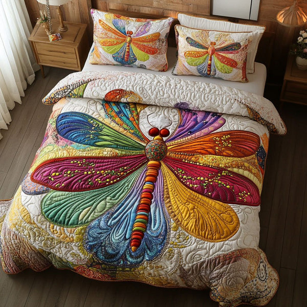 Radiant Reflections quilted 3-piece bedding set on a made bed with two matching pillow shams