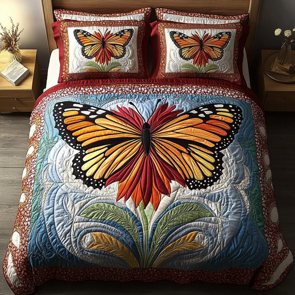 Radiant Wings quilted 3-piece bedding set on a made bed with two matching pillow shams