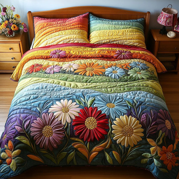 Rainbow Bloom quilted 3-piece bedding set on a made bed with two matching pillow shams