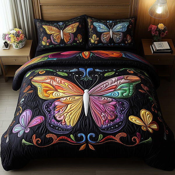 Rainbow Butterfly quilted 3-piece bedding set on a made bed with two matching pillow shams