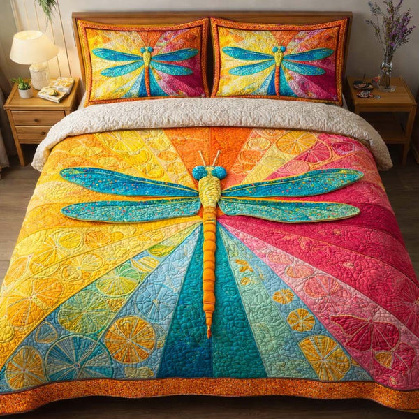 Rainbow Dragonfly quilted 3-piece bedding set on a made bed with two matching pillow shams
