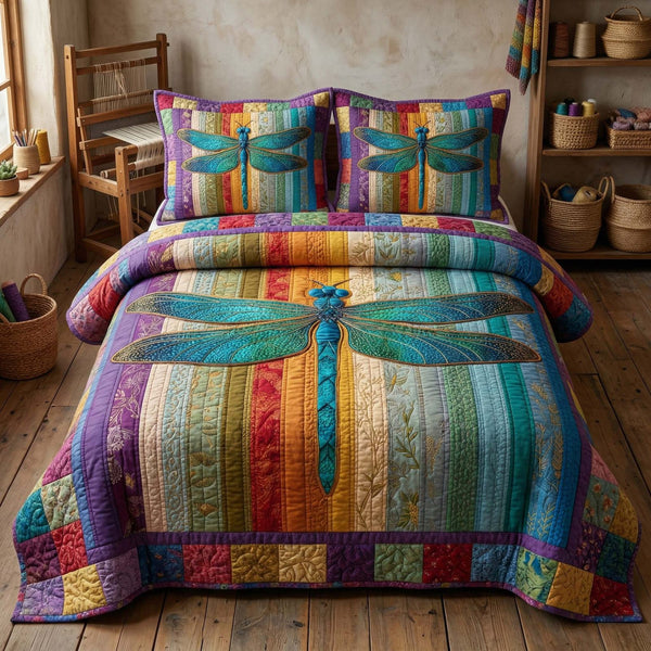 Rainbow Dragonfly quilted 3-piece bedding set on a made bed with two matching pillow shams