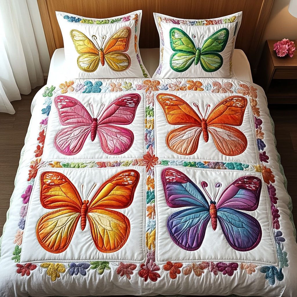 Rainbow Flutter Wings quilted 3-piece bedding set on a made bed with two matching pillow shams