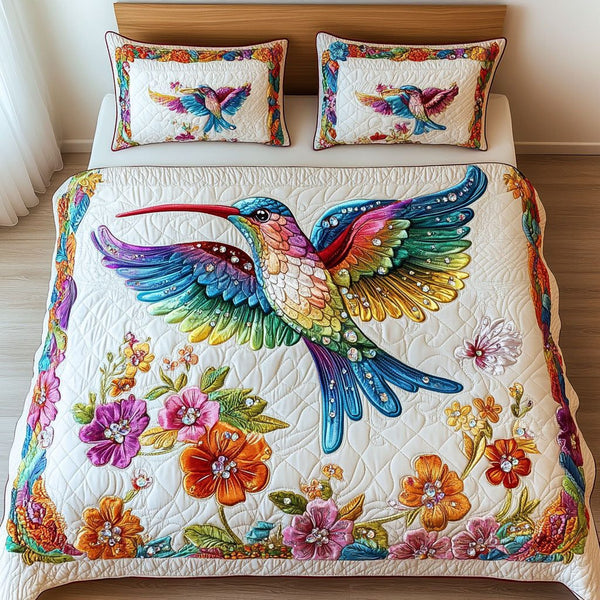 Rainbow Glimmer quilted 3-piece bedding set on a made bed with two matching pillow shams