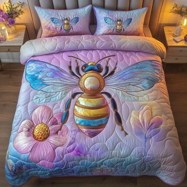 Rainbow Glow Bee quilted 3-piece bedding set on a made bed with two matching pillow shams