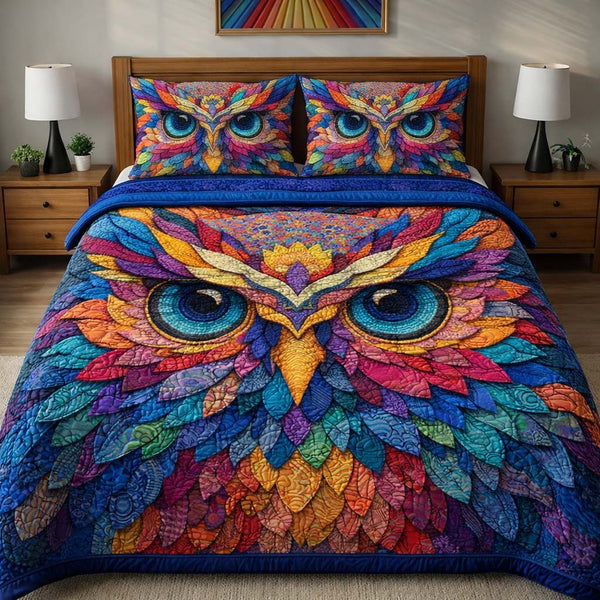 Rainbow Majesty Owl quilted 3-piece bedding set on a made bed with two matching pillow shams