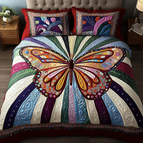 Rainbow Monarch quilted 3-piece bedding set on a made bed with two matching pillow shams