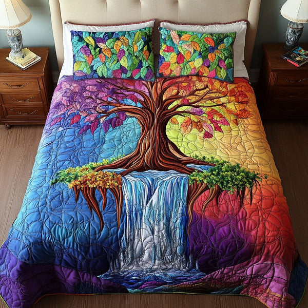 Rainbow Tree Waterfall quilted 3-piece bedding set on a made bed with two matching pillow shams