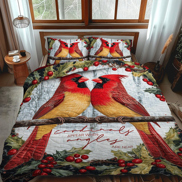 Red Beauties quilted 3-piece bedding set on a made bed with two matching pillow shams
