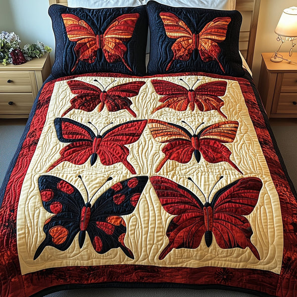 Red Butterfly quilted 3-piece bedding set on a made bed with two matching pillow shams