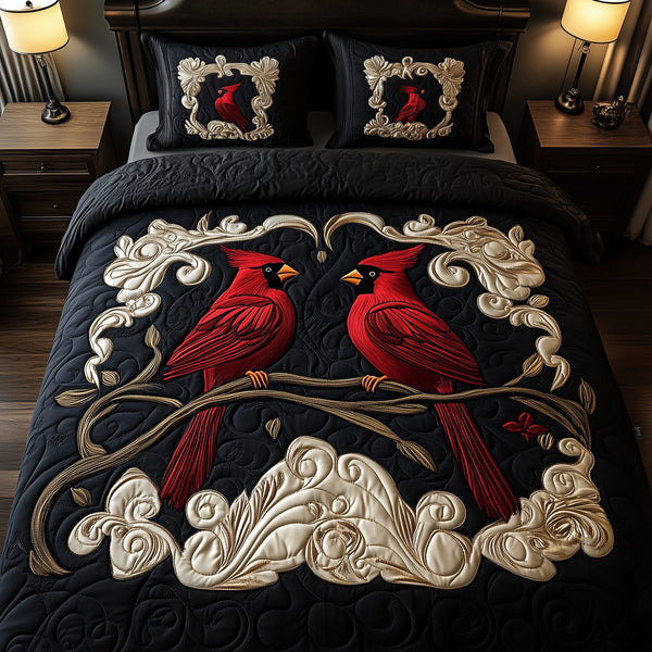 Red Cardinal Couple quilted 3-piece bedding set on a made bed with two matching pillow shams