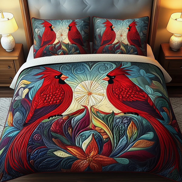 Red Cardinal Couple quilted 3-piece bedding set on a made bed with two matching pillow shams