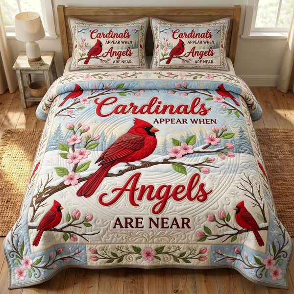 Red Cardinal quilted 3-piece bedding set on a made bed with two matching pillow shams