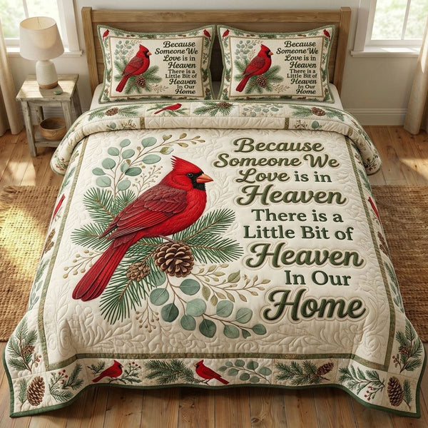 Red Cardinal quilted 3-piece bedding set on a made bed with two matching pillow shams