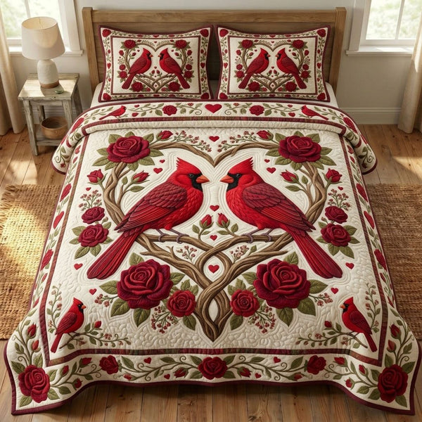 Red Cardinal quilted 3-piece bedding set on a made bed with two matching pillow shams