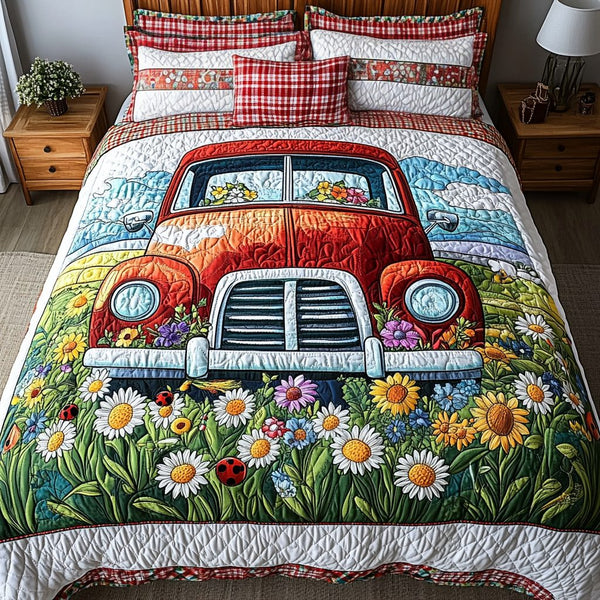 Red Truck Blooms quilted 3-piece bedding set on a made bed with two matching pillow shams