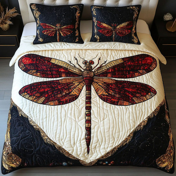 Red Twilight Dragonfly quilted 3-piece bedding set on a made bed with two matching pillow shams