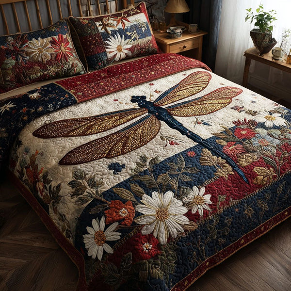 Red White and Blue Wings quilted 3-piece bedding set on a made bed with two matching pillow shams